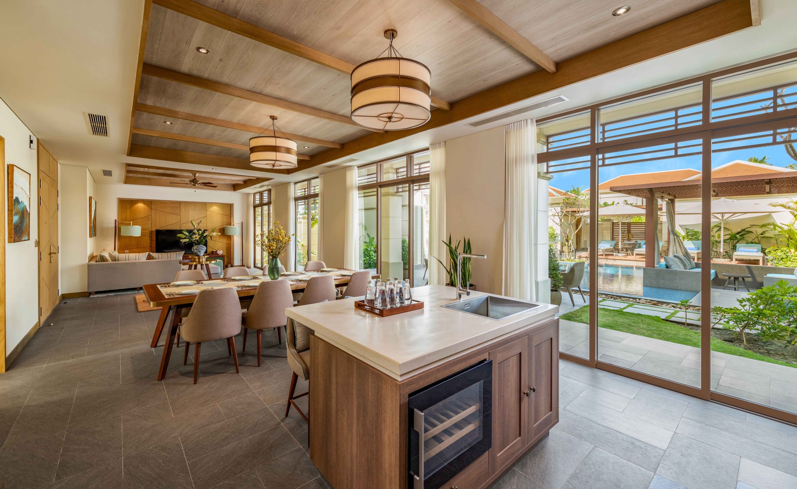 The dining and kitchen area of a pool villa at Fusion Resort