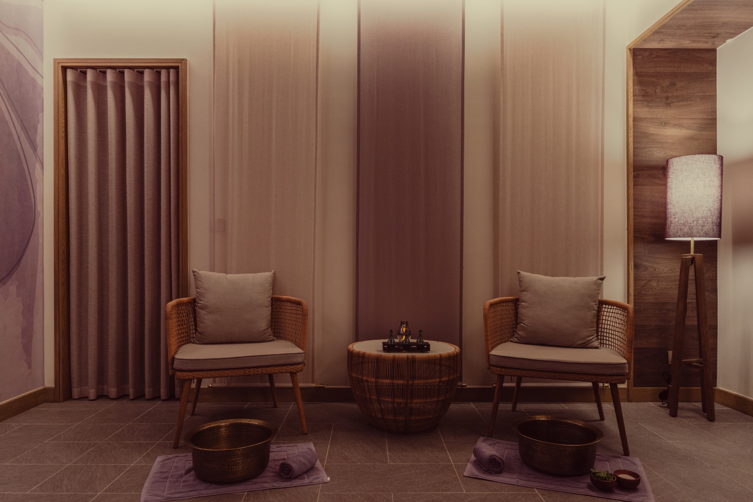 Spa foot-soak relaxation area at Danang beach wellness resort, luxury chairs and calming atmosphere